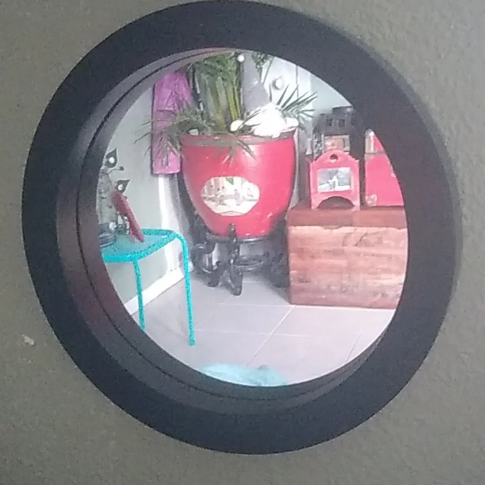 Four black round wall mirrors